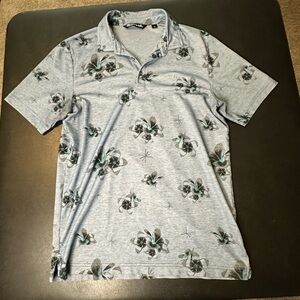 Travis Mathew Light Blue Polo Shirt with Floral Design